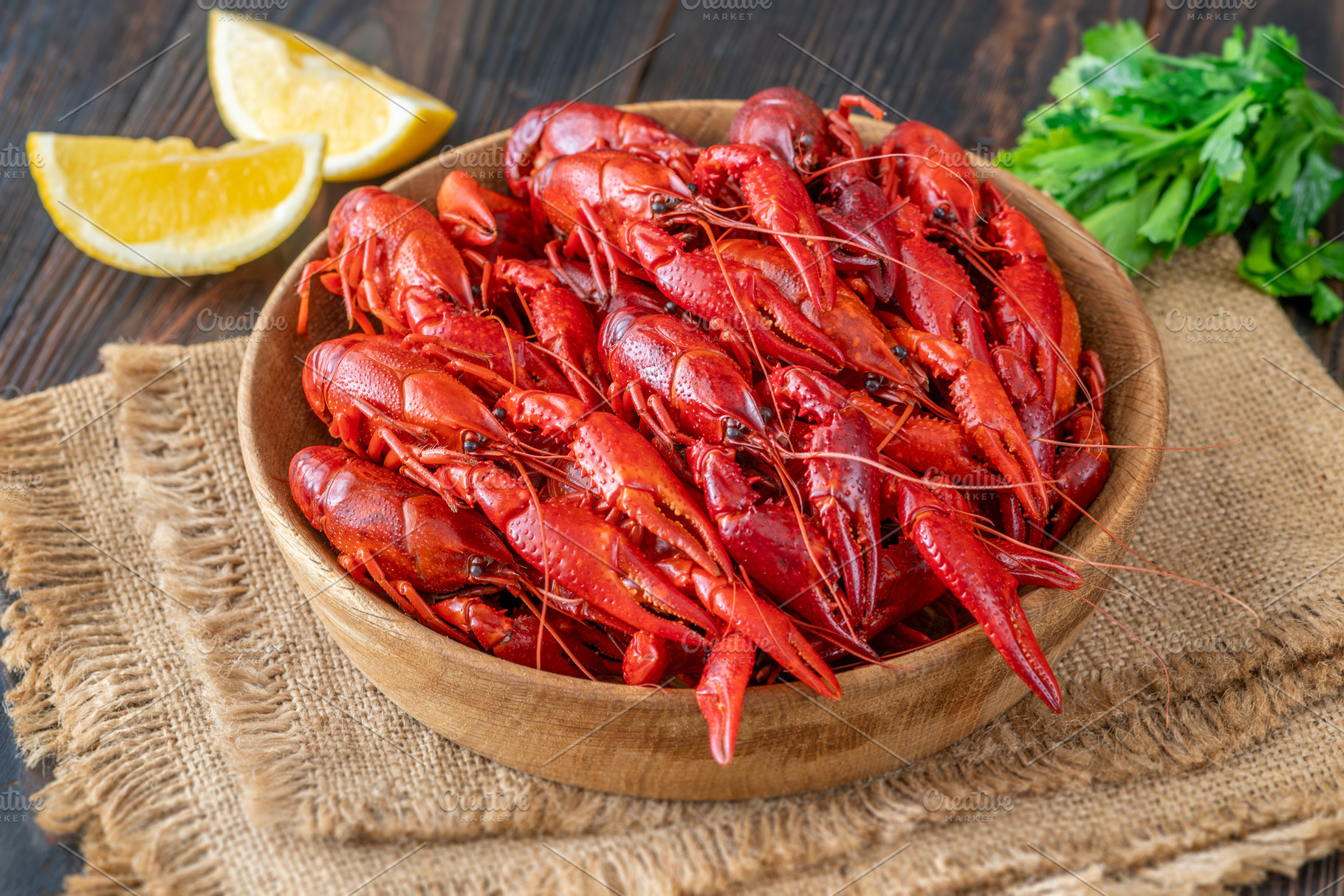 Wooden bowl of bright red boiled cra, a Food & Drink Photo by Alexander Prokopenko