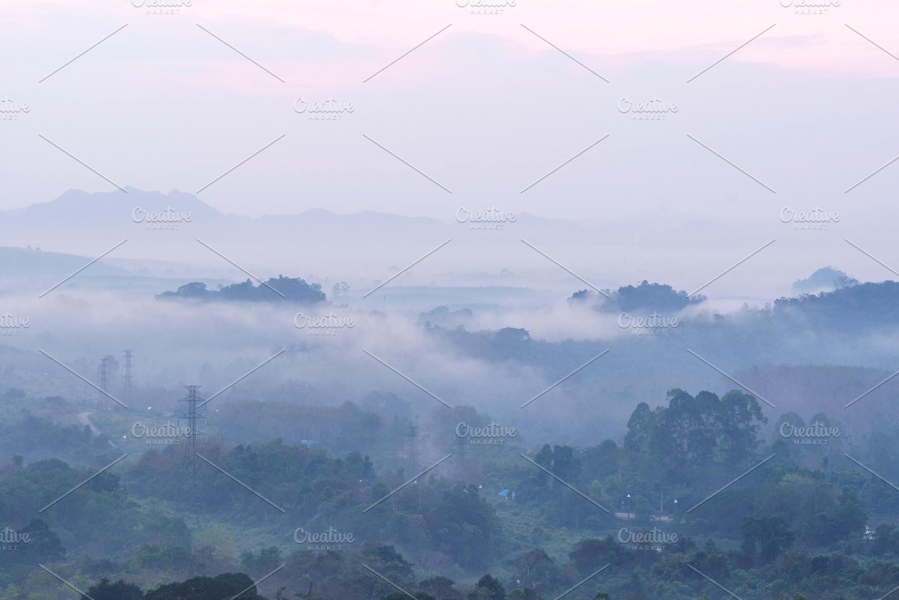 Misty landscape with rolling hills and trees at dawn, creating serene atmospher, a Nature Photo by a454