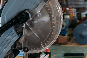 Miter saw circular blade sharp carpentry equipment, an Industrial Photo by Photo Drive Studio