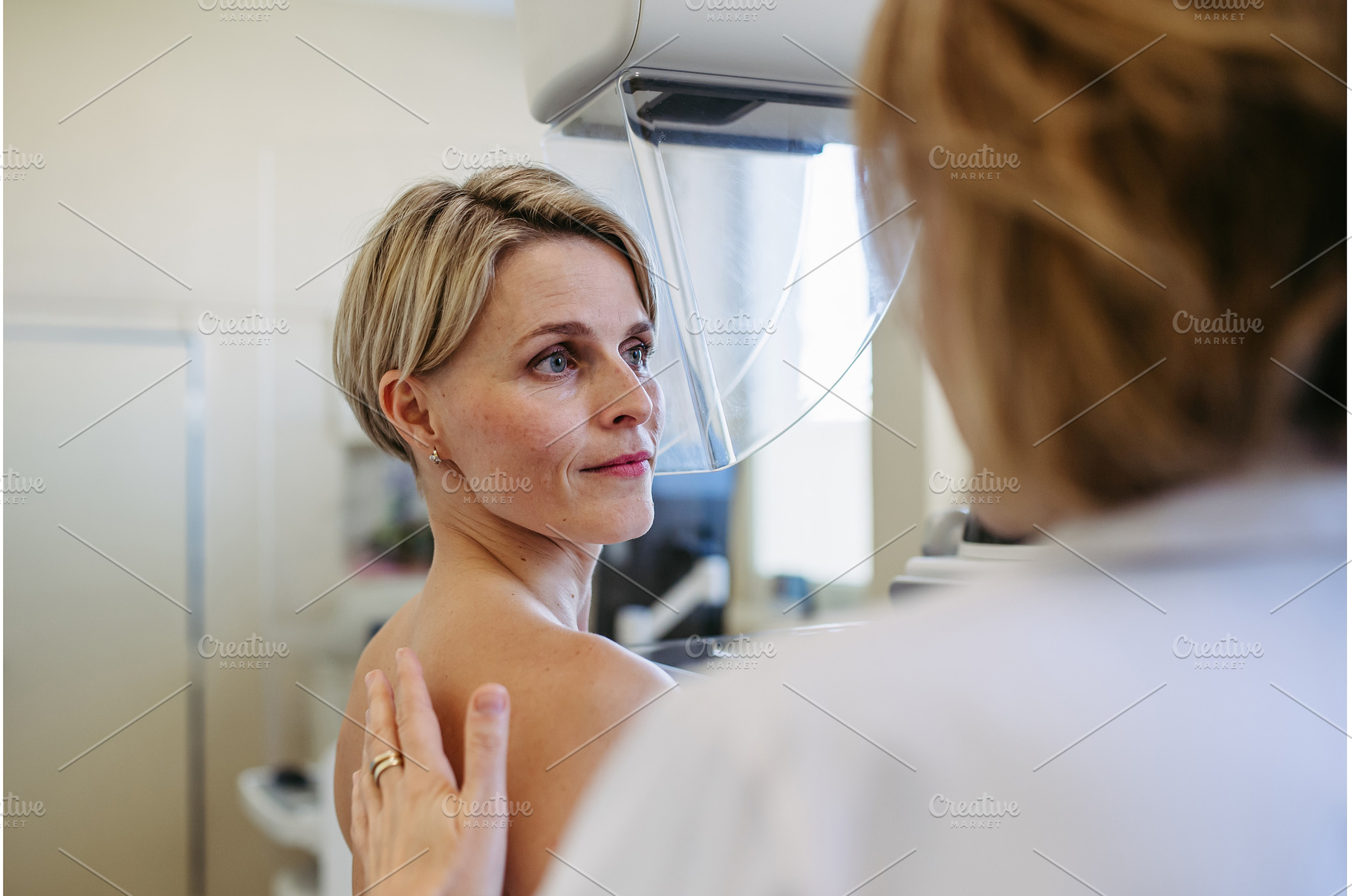 Medical professional calming patient, a Person Photo by HalfPoint