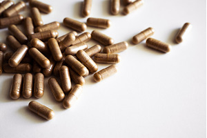 Brown herbal capsules close up, a Health & Medical Photo by volodymyrshtun13795