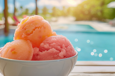 A bowl of colorful sorbet by a poolside, with a tropical setting, a Food & Drink Photo by Mashimara