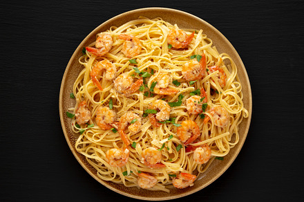 Baked Shrimp Scampi Linguine Pasta with Parsley on a Plate, top, a Food & Drink Photo by LiudmylaChuhunova