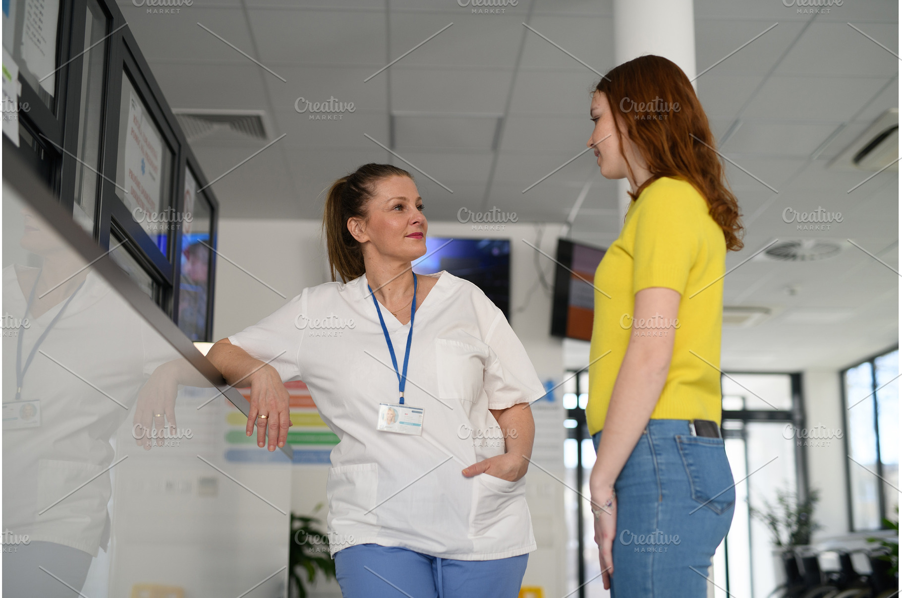 Nurse talking with teenage patient, a Person Photo by HalfPoint