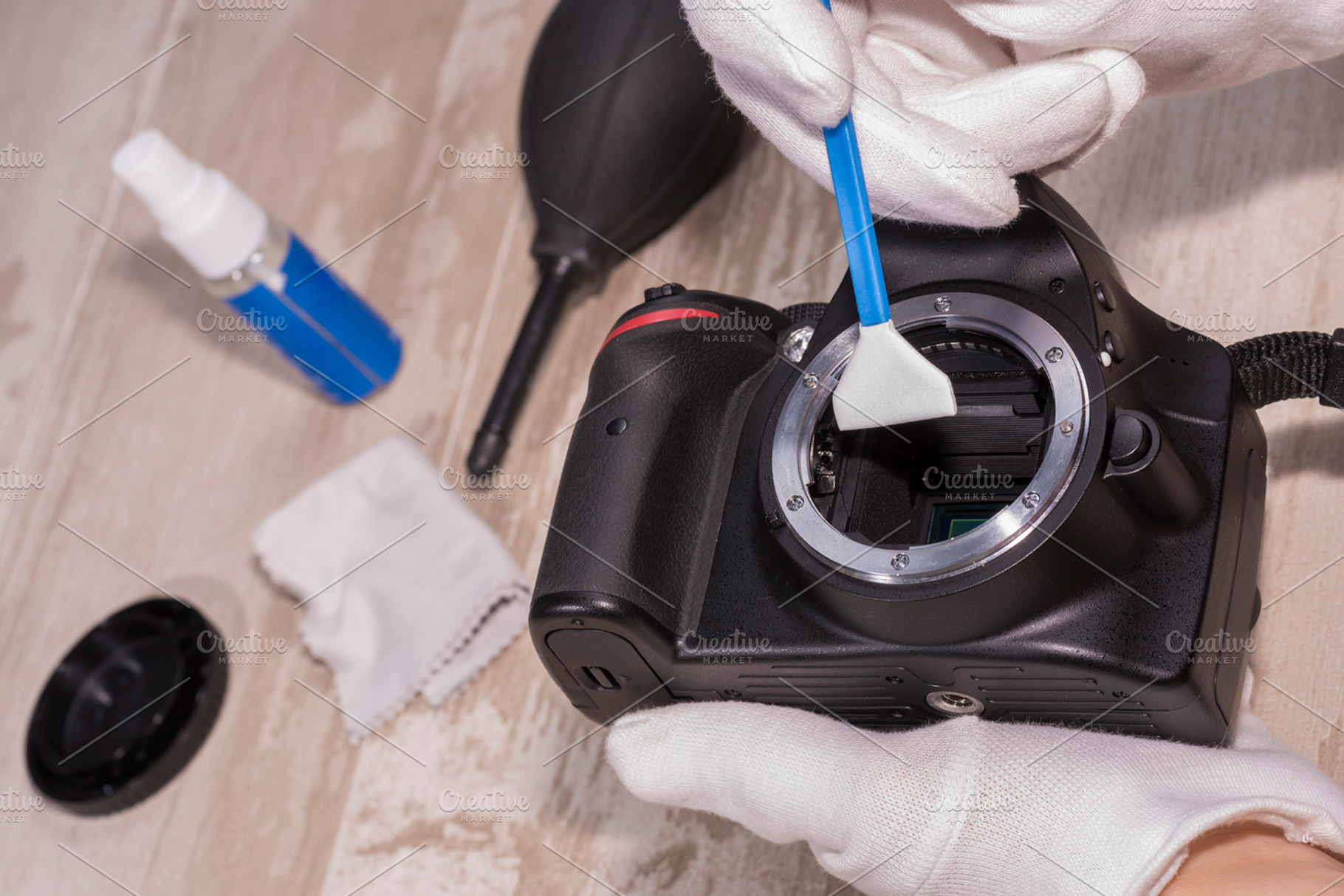 Sensor cleaning stock photo containing antistatic glove and blower, a Technology Photo by Josfor photos