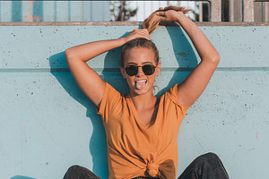 Young female model wearing yellow stock photo containing skate and park