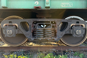 A close-up view of a train wheel assembly, showcasing the wheel, axle, and susp, an Industrial Photo by Textures & Backgrounds