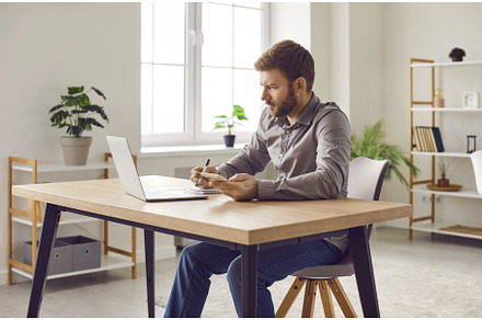 Focused businessman using smartphone, a Person Photo by StudioRomantic