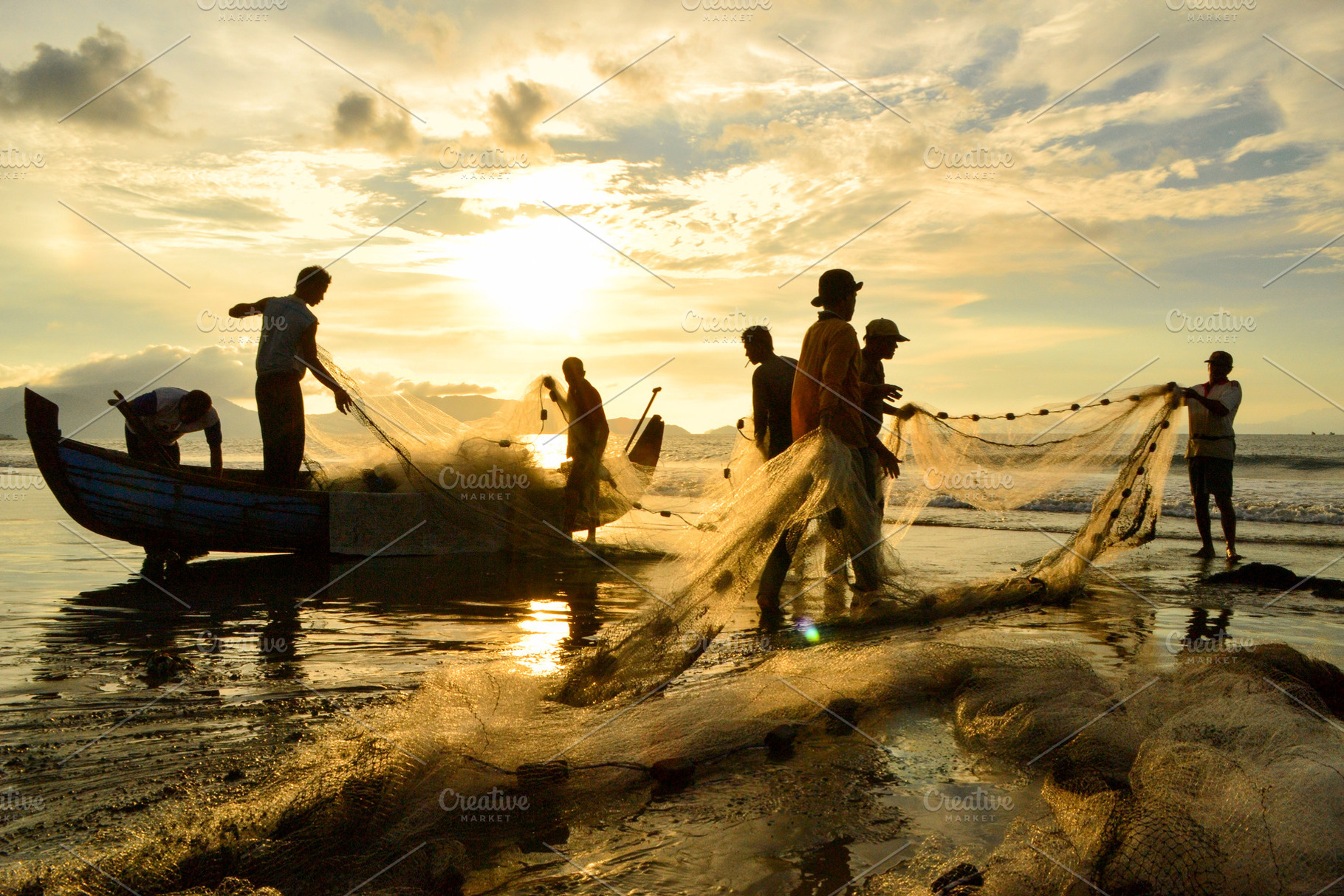 Fishermen Pulling Nets As the SunSet, a Person Photo by bastera