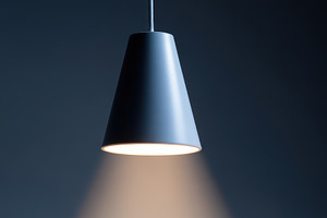 Modern Pendant Light Casting Focused Beam, an Abstract Photo by AlyaAnd