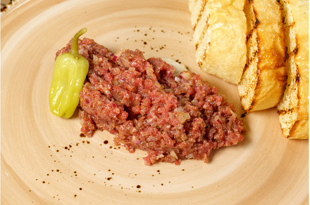 Raw beef tartar served on rye bread, a Food & Drink Photo by darksoul72