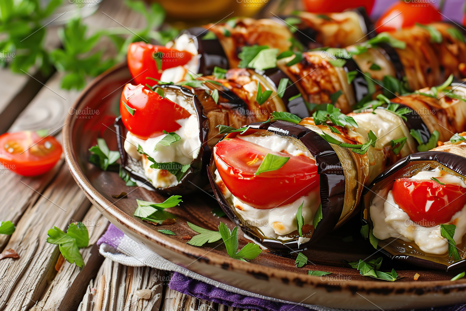 Rolled up eggplant stuffed with cheese and tomatoes in plate, a Food & Drink Photo by AlyaAnd
