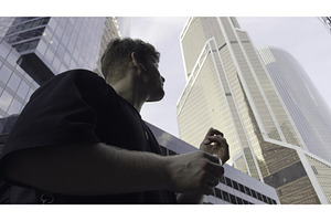 Young manager walking and talking on, an Architecture Photo by Media Whale Stock