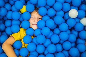 Child playing in ball pit. Colorful, a Person Photo by Elizaveta Galitskaya