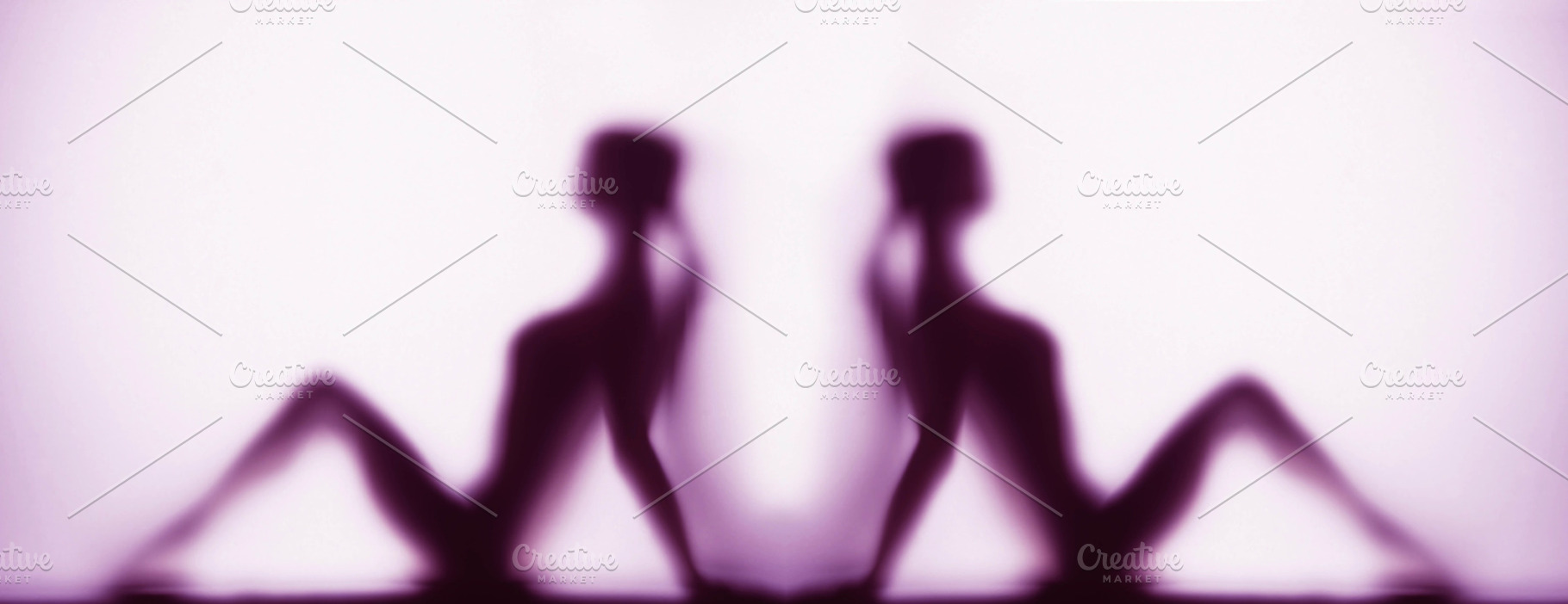 Silhouette of two women in yoga pose, a Photo by Photos from the Heart