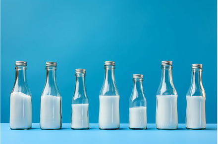 Cylindrical Glass bottle milk, a Food & Drink Photo by Ylivdesign