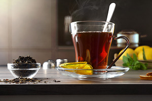 Detail of cup of hot tea in dark kitchen, a Food & Drink Photo by Davizro's Market