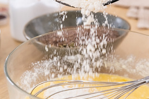 Dough making pouring flour batter whisk bowl table, a Food & Drink Photo by Photo Drive Studio