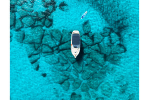 Aerial view of Yacht anchored in, a Nature Photo by den-belitsky