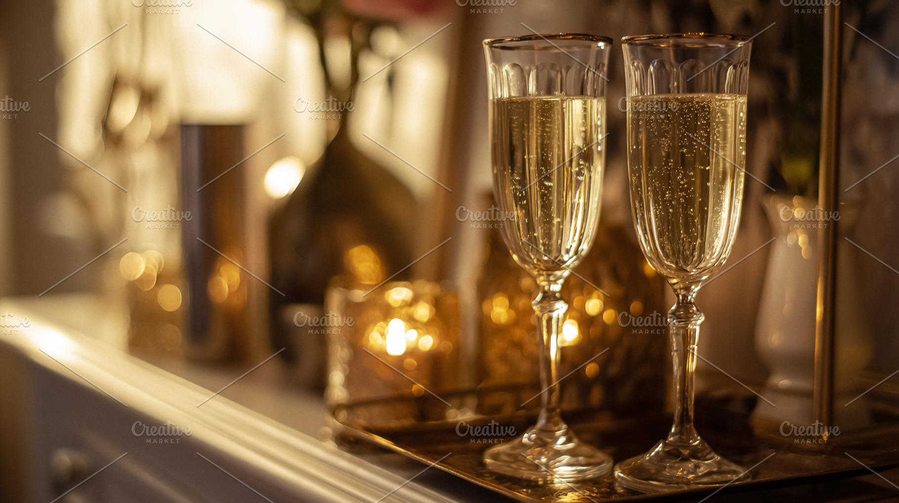 Celebrating a special occasion with two champagne flutes filled, a Photo by Studio ANNA