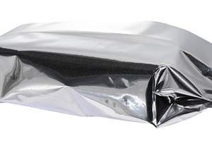 Crumpled silver foil packaging with torn edges, isolated backgro, a Food & Drink Photo by ndanko