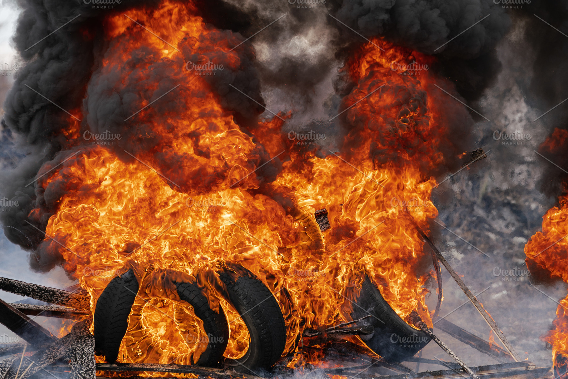 Burning cars tires flame red fire, a Transportation Photo by Alexander-Piragis