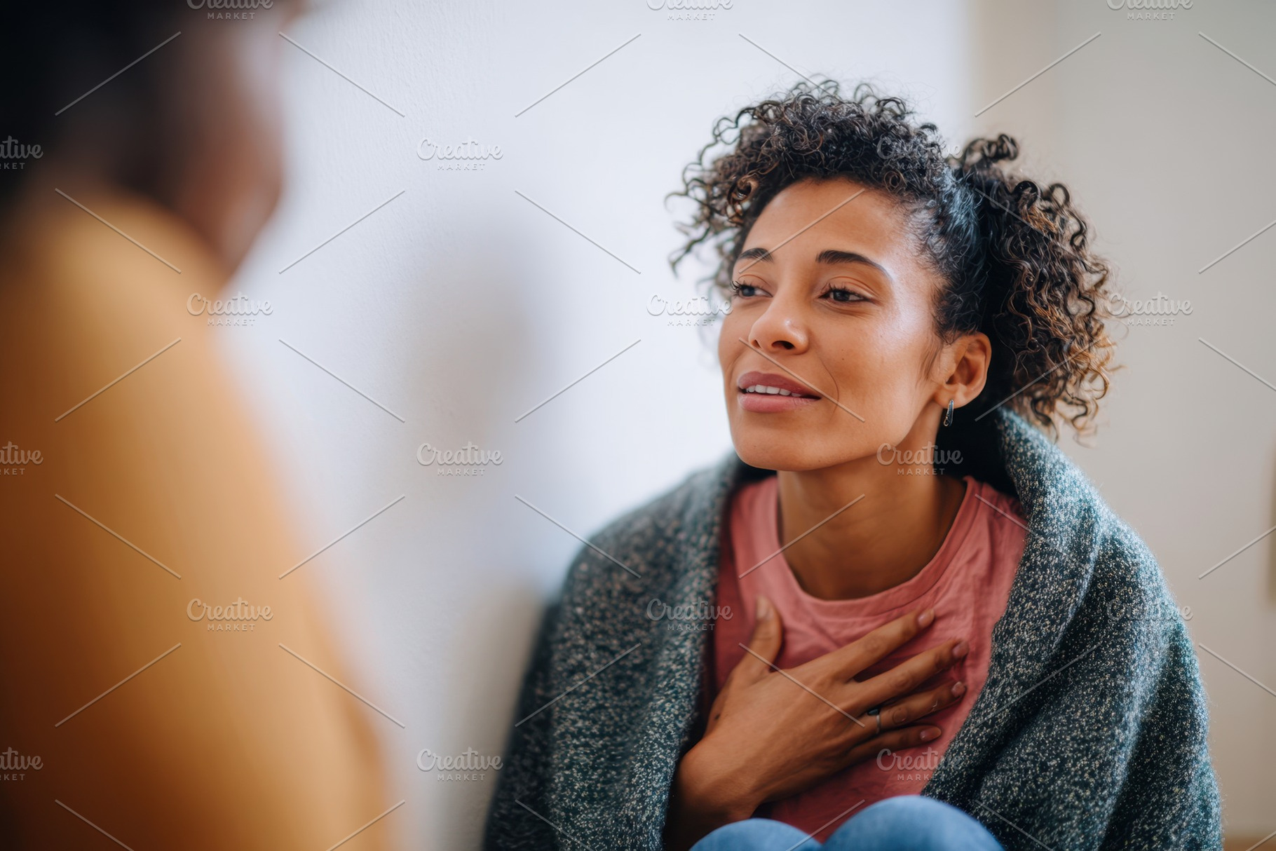 Woman practicing mindfulness in a cozy setting, a Health & Medical Photo by AlyaAnd
