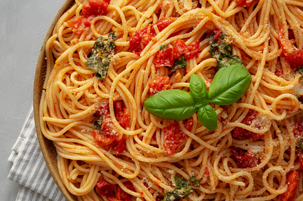 Homemade Spaghetti With Fresh Tomato Sauce on a Plate, top view., a Food & Drink Photo by LiudmylaChuhunova