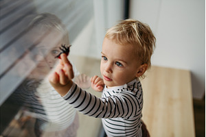 Adorable toddler boy playing with, a Person Photo by HalfPoint