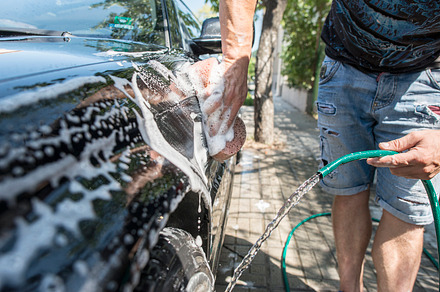 Men wash his car, a Person Photo by Deyan Georgiev