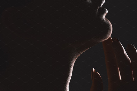 Woman beauty silhouette, face and dark, sexy with cosmetics and seductive  fantasy with mysterious aesthetic. Female profile closeup with skin, sexy  woman facial against black studio background., a Photo by Peopleimages.com |