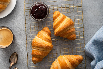 Fresh summer breakfast with croissants and berry jam, a Food & Drink Photo by farwasser