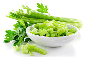 Green fresh celery pieces in bowl on white background, a Food & Drink Photo by AlyaAnd