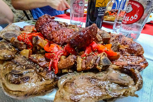 Mixed grilled meats on rustic dining table, a Food & Drink Photo by DanFLCreativo