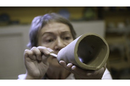 An artisan potter presents a unique, a Background Photo by Media Whale Stock