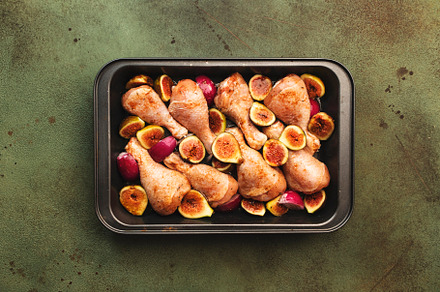 Raw chicken legs, drumsticks with sweet figs and red onions in b, a Food & Drink Photo by 5PH
