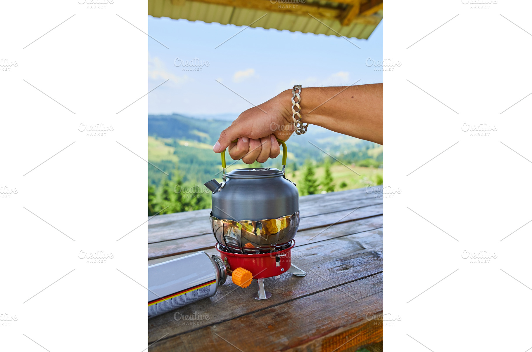 Preparing hot water outdoors with a, a Nature Photo by IlliaBondarPhotography