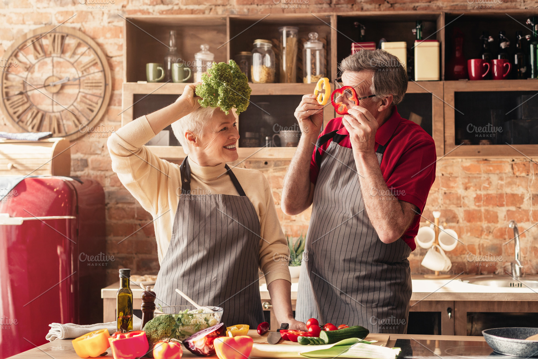 Elderly couple having fun in kitchen, a Photo by Prostock-Studio ...
