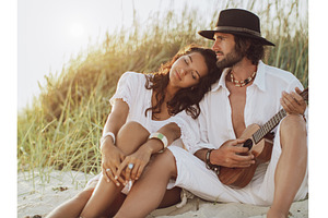 Couple in Love Playing Guitar and