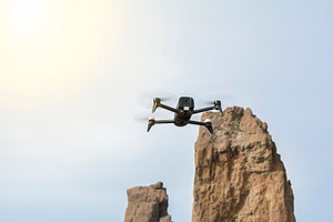 Drone flying high stock photo containing drone and drones