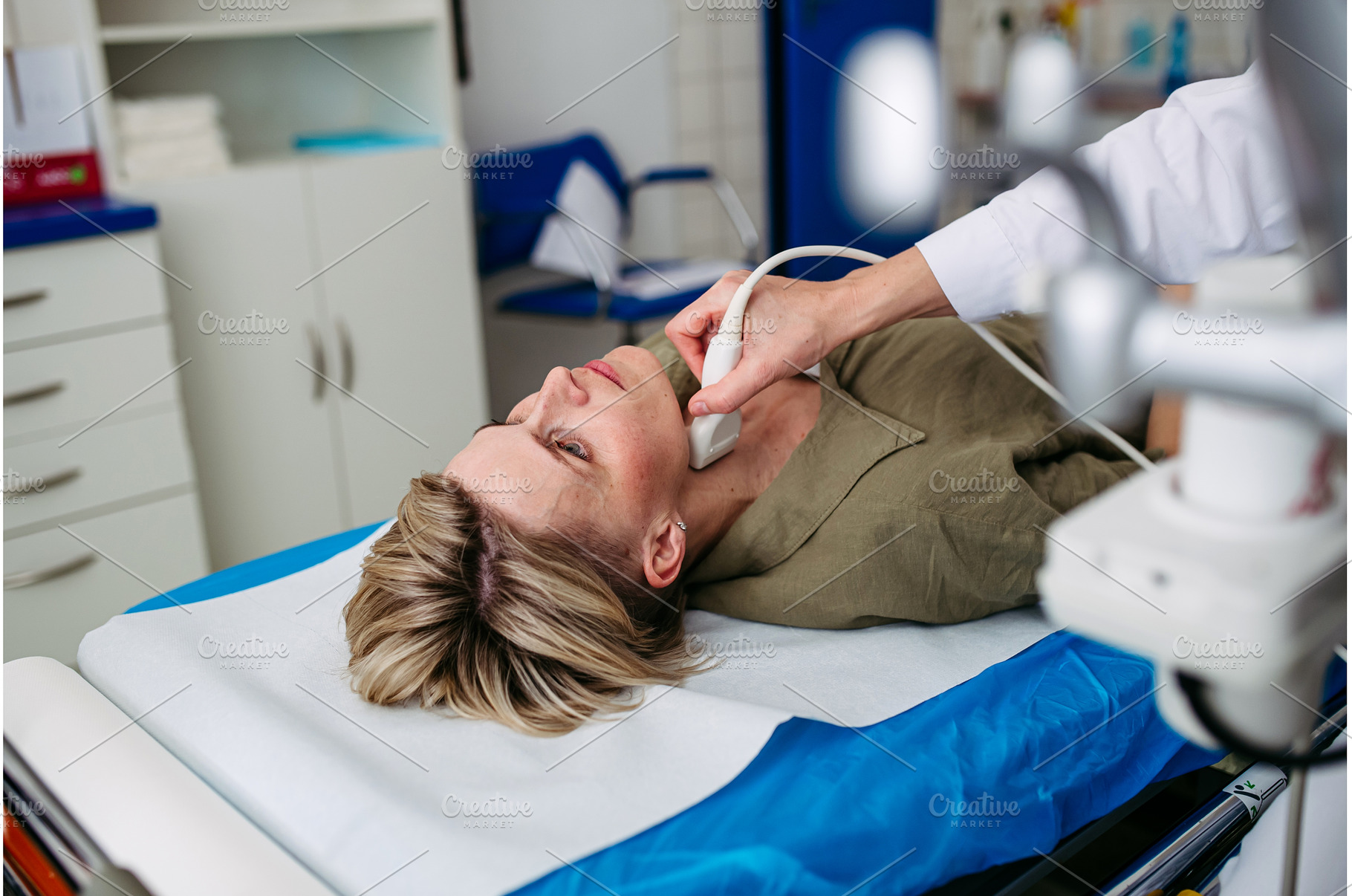 Female patient undergoing thyroid, a Health & Medical Photo by HalfPoint