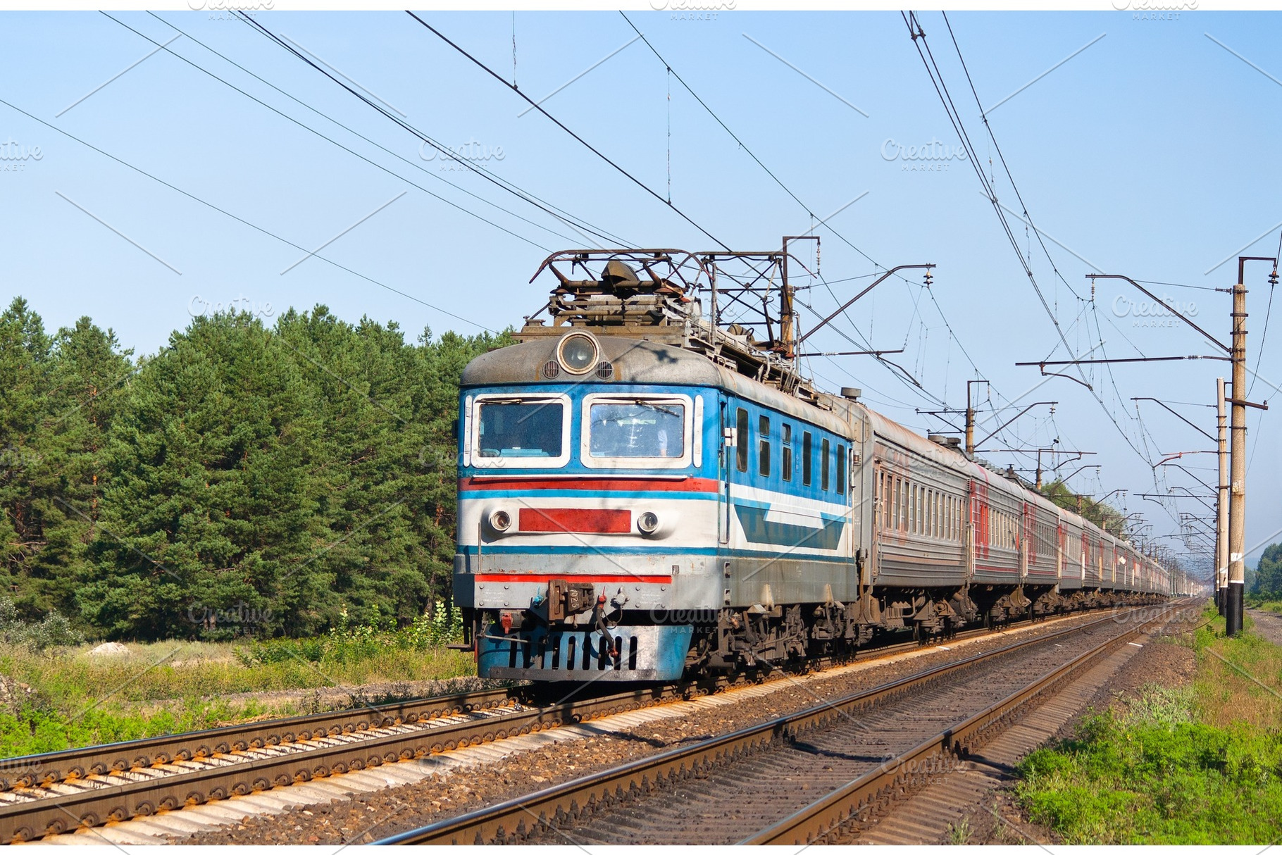 Passenger train hauled by electric locomotive stock photo containing train, a Transportation Photo by Leonid Andronov
