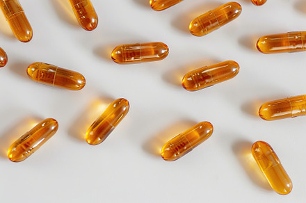 Colorful medicine capsules on white background, a Health & Medical Photo by AlyaAnd