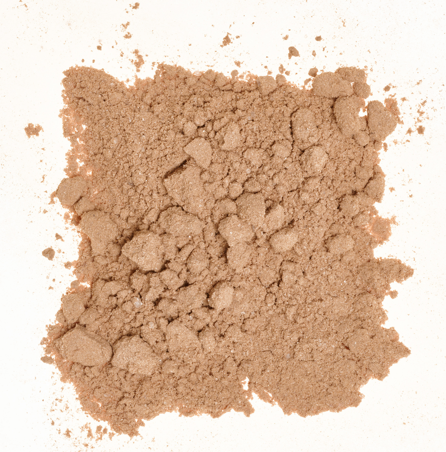 Spilled cocoa powder with small lumps, forming an uneven texture, a ...