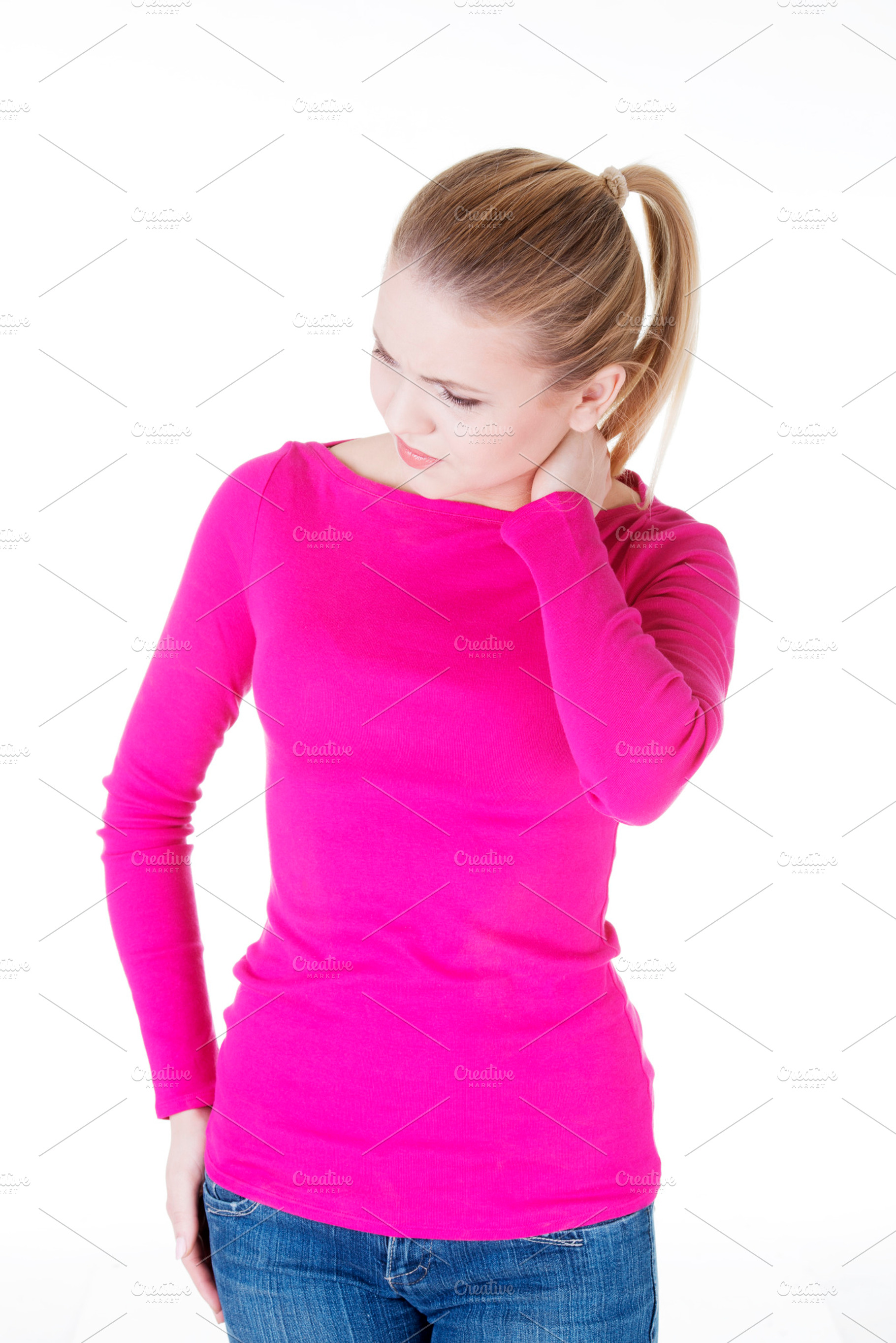 Young casual woman is touching her neck stock photo containing pain and, a Person Photo by PhotoMediaGroup