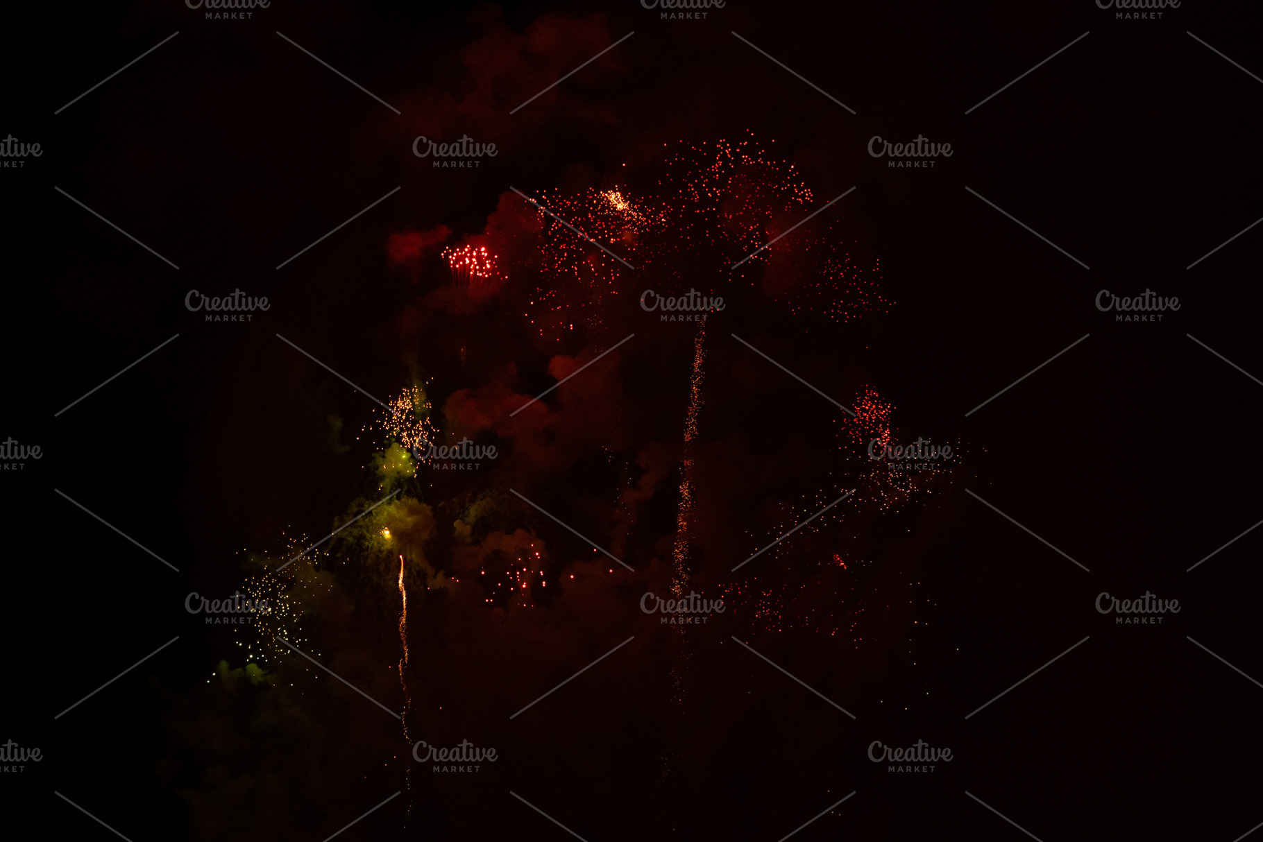 Fireworks exploding behind a wall of smoke, a Holiday Photo by rubenchase