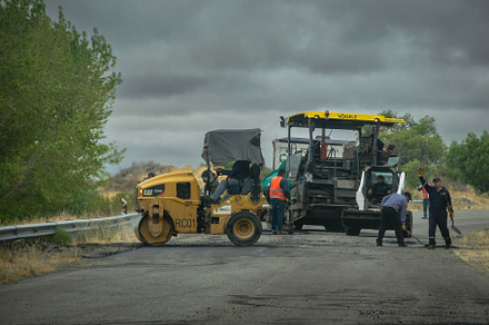 Construction workers is engaged in road maintenance, chubut, arg, a Transportation Photo by DanFLCreativo