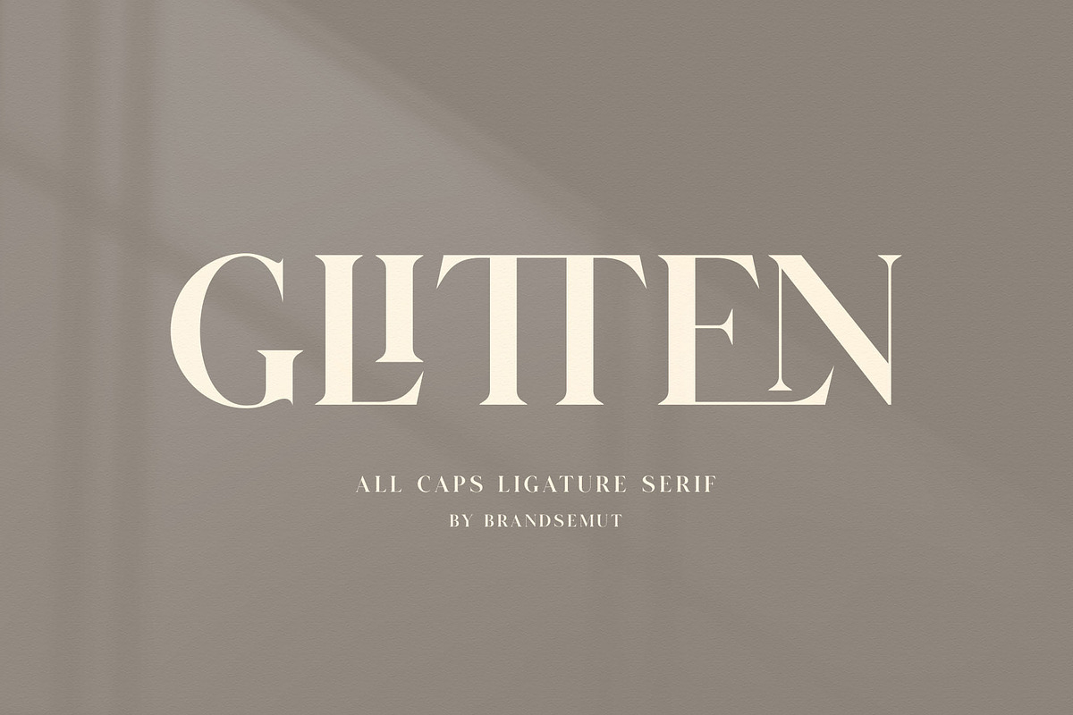 GLITTEN - All Caps Ligature Serif, a Serif Font by BrandSemut (Photo 1 of 9)