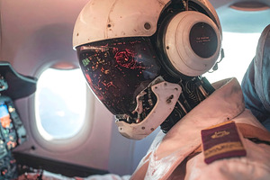 Robot pilot operating aircraft cockpit with visible reflections, a Technology Photo by GoodGoods