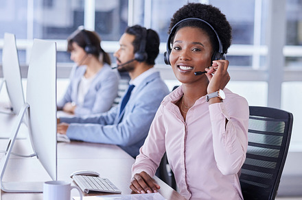 Black woman, call center and portrait smile with headset for telemarketing, customer support or service at the office. Happy African American female consultant smiling for online advice in contact us, a Photo by Peopleimages.com